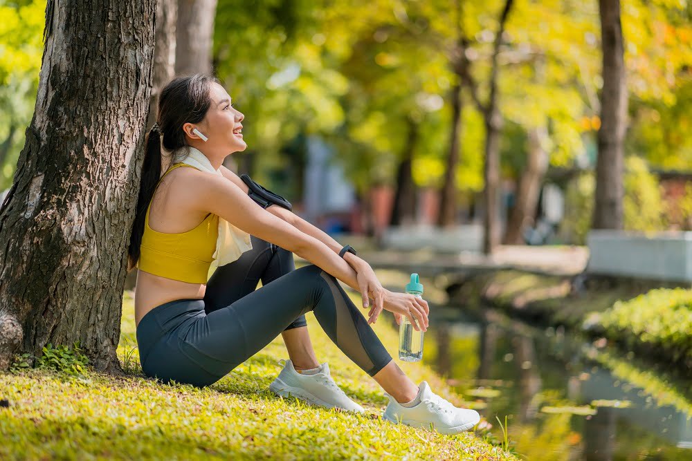 A lady taking a break from running A lady taking a break from running